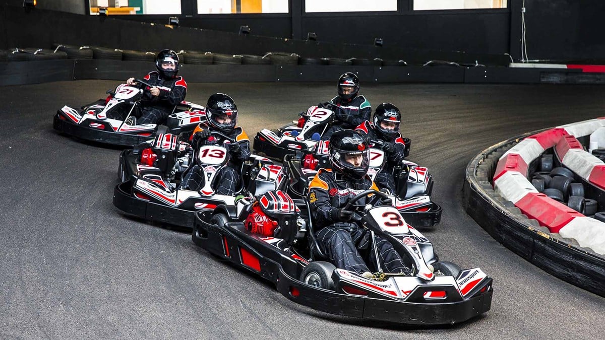 A group of people Go-Karting